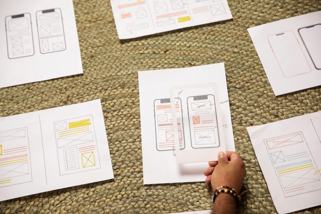 mobile app idea and raw design on paper